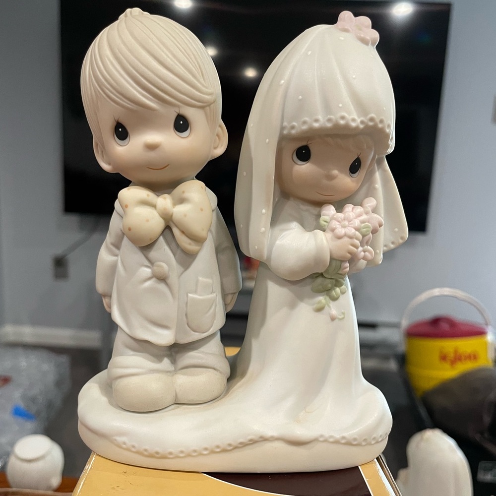 Precious moments, bride, and groom figurines
